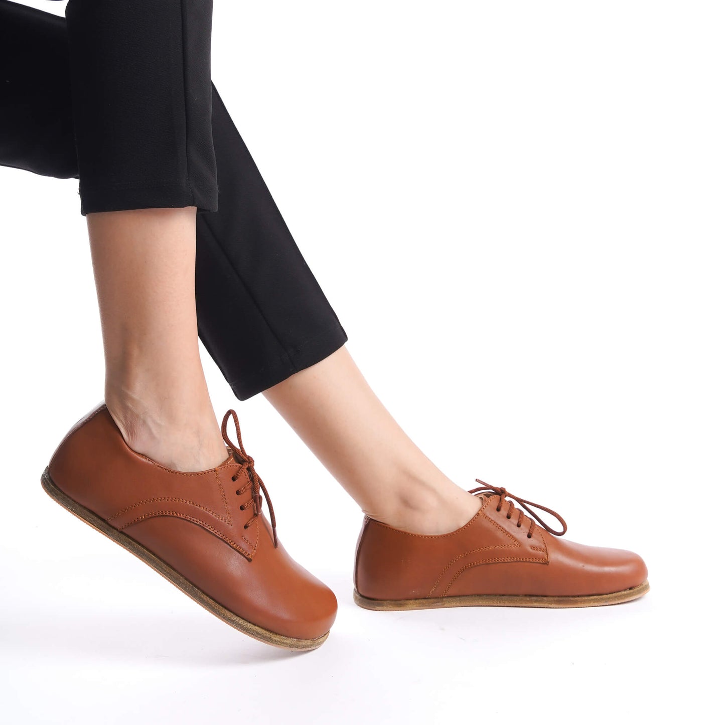 Close-up of Locris Tan Brown Leather Barefoot Women Oxfords on a model, emphasizing wide toe box and zero-drop design.