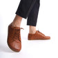 Tan brown Lydia leather barefoot women's sneakers with wide toe box, showcased in a stylish manner.