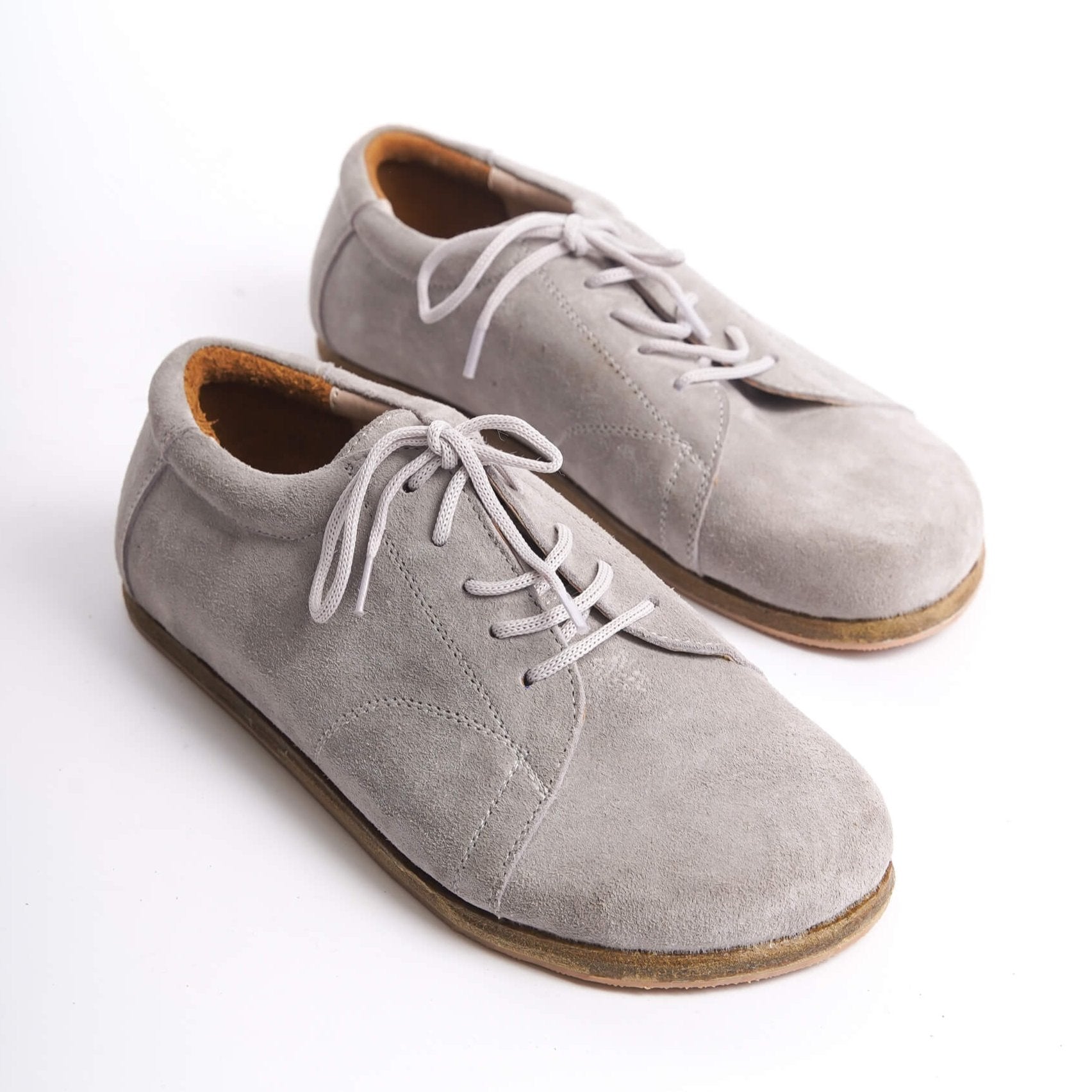 Gray suede barefoot women's sneakers by Pelanir, featuring genuine leather and a zero-drop design for natural foot health.