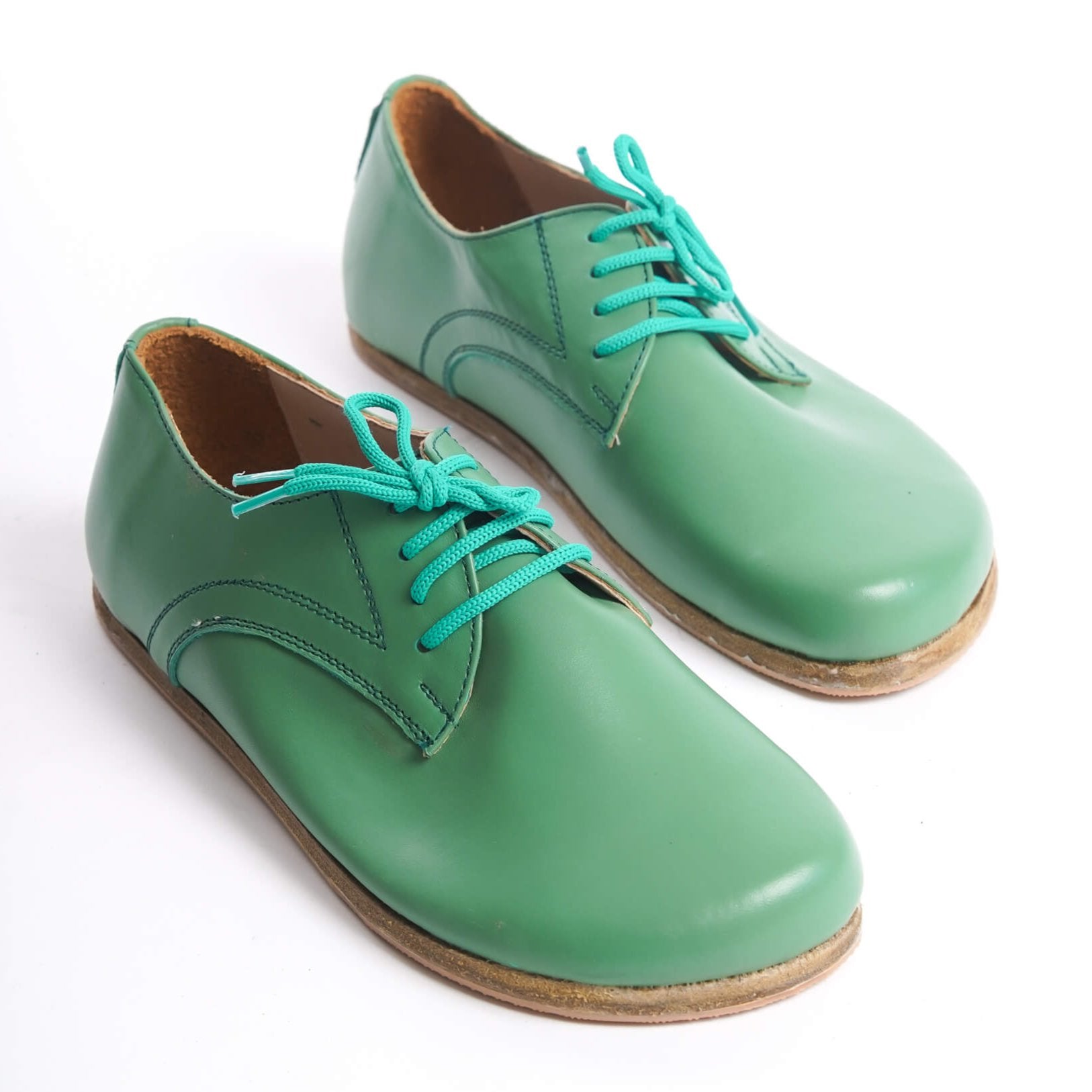 Top view of green Locris Leather Barefoot Women Oxfords showcasing genuine leather and minimalist design. Perfect for foot health and comfort.