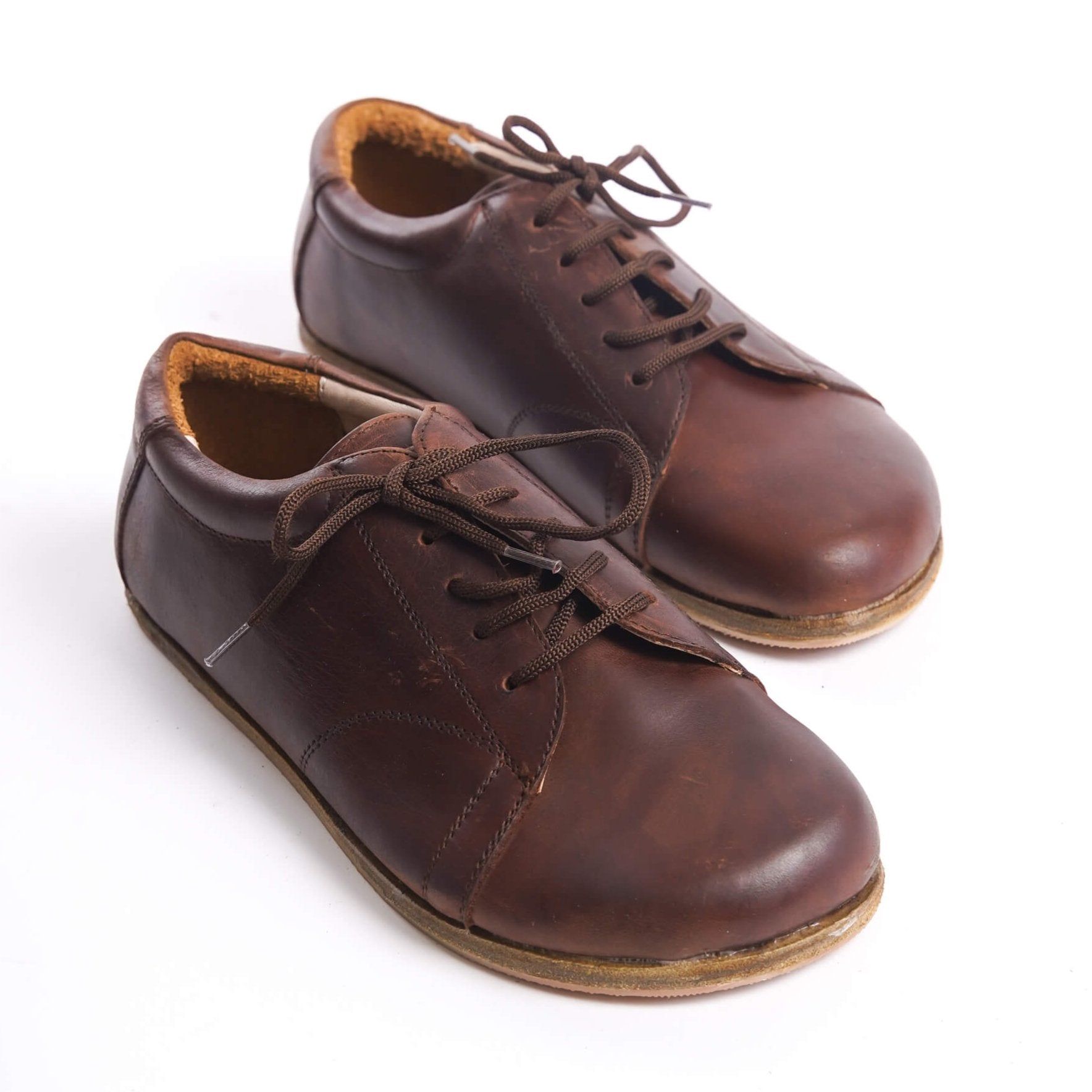 Lydia Leather Barefoot Women Sneakers in brown, showcasing the front view with laces, made from genuine leather.