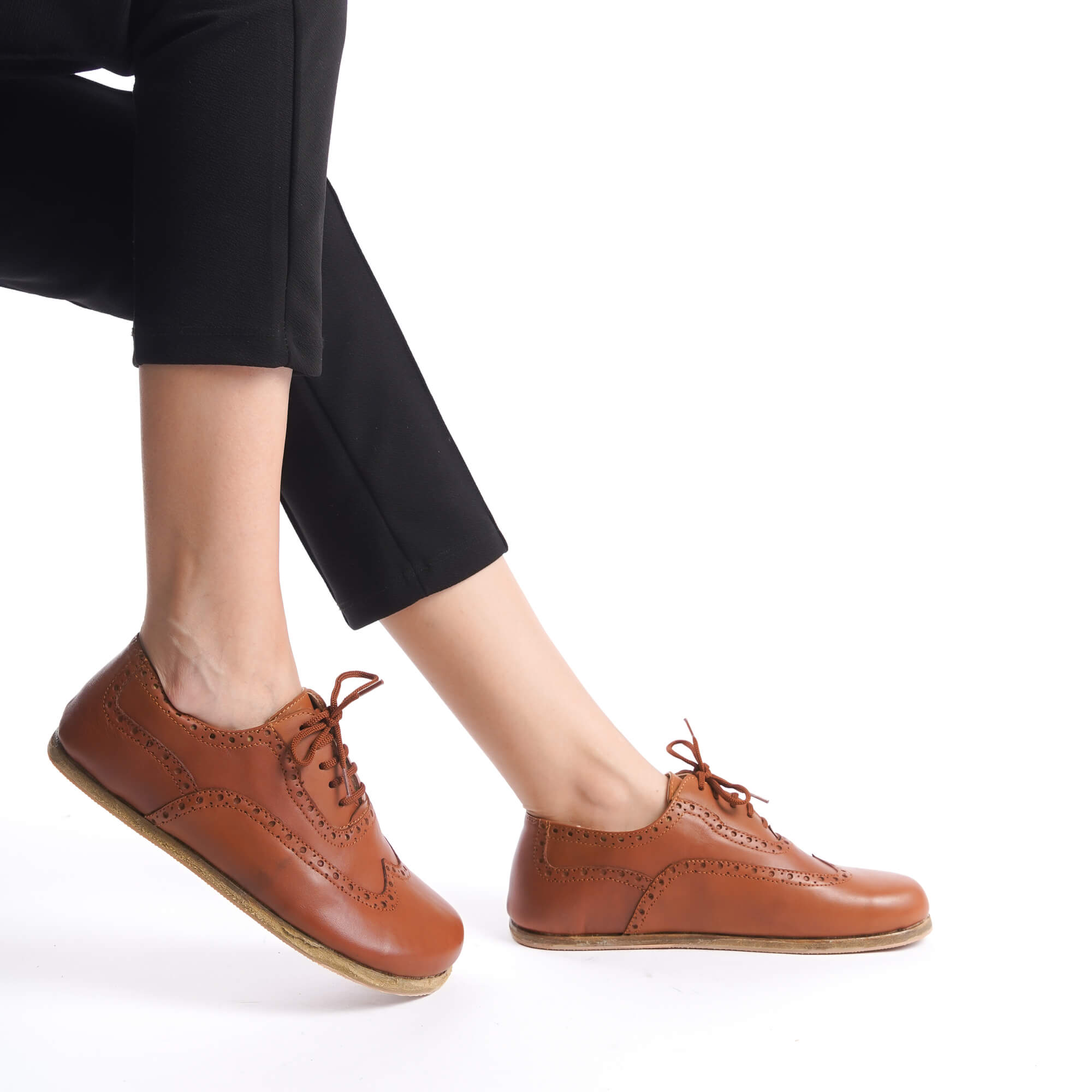 Side view of tan brown Doris leather barefoot women Oxfords, highlighting the detailed craftsmanship and comfortable fit.