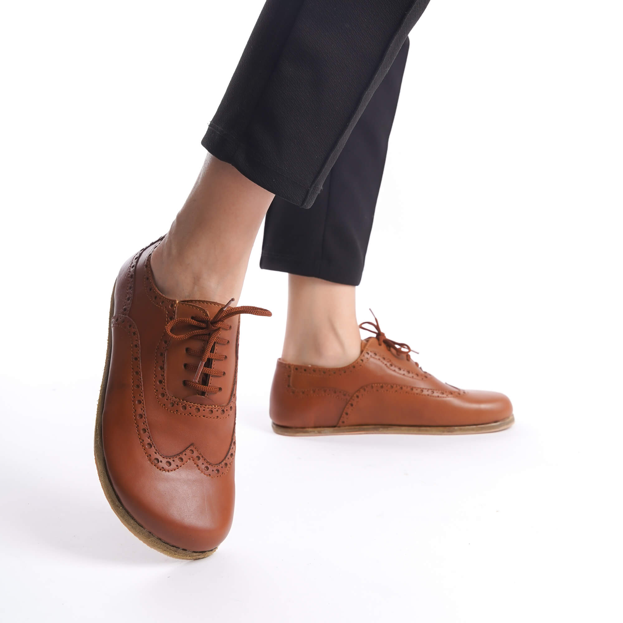 Close-up of tan brown Doris leather barefoot women Oxfords, showing the brogue detailing and lace-up design.