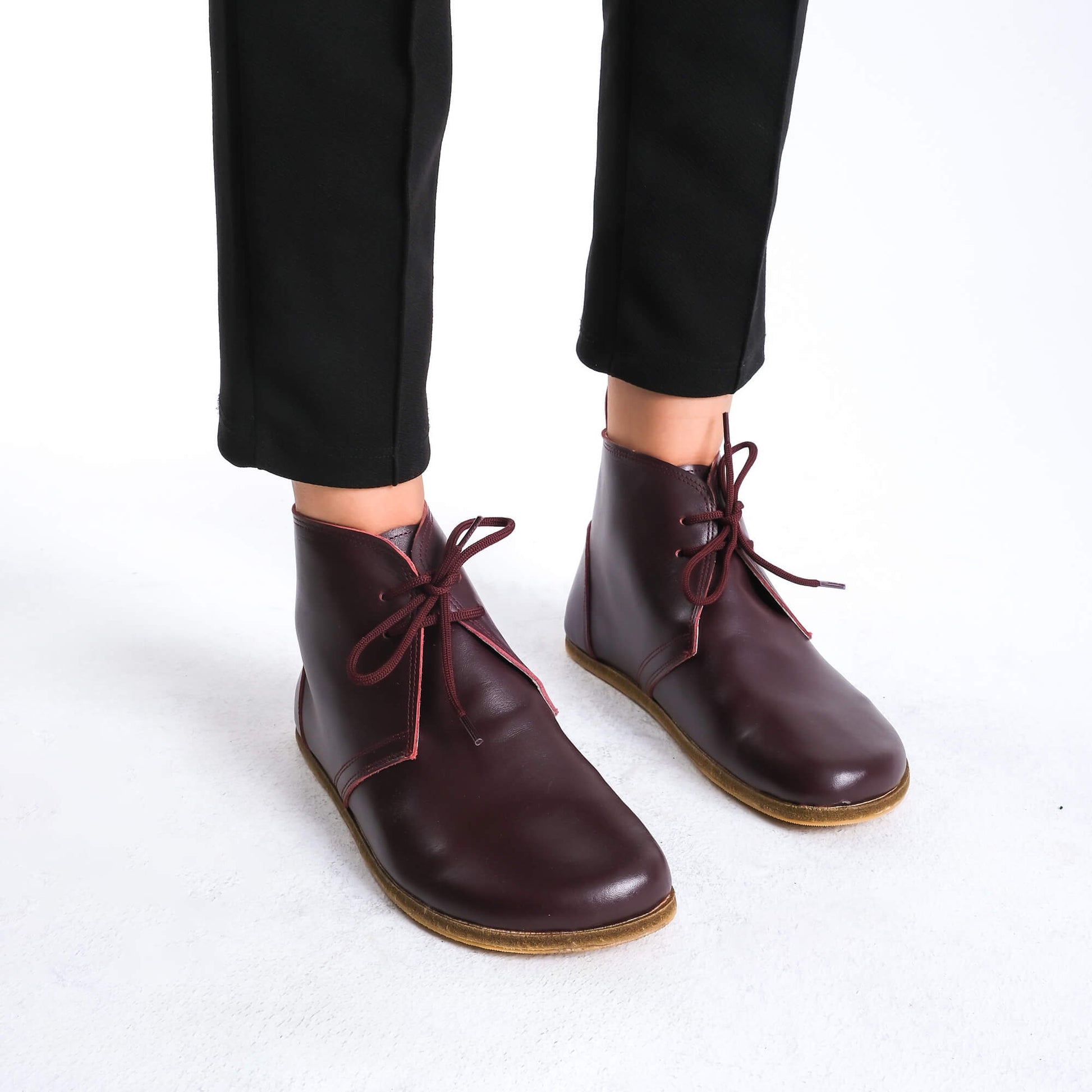 Premium burgundy barefoot boots showcasing a sleek design for a modern aesthetic.