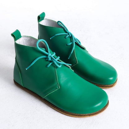 Stylish green barefoot ankle boots with a minimalist design, perfect for comfort.