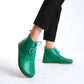 Versatile green barefoot ankle boots, blending style and comfort effortlessly.