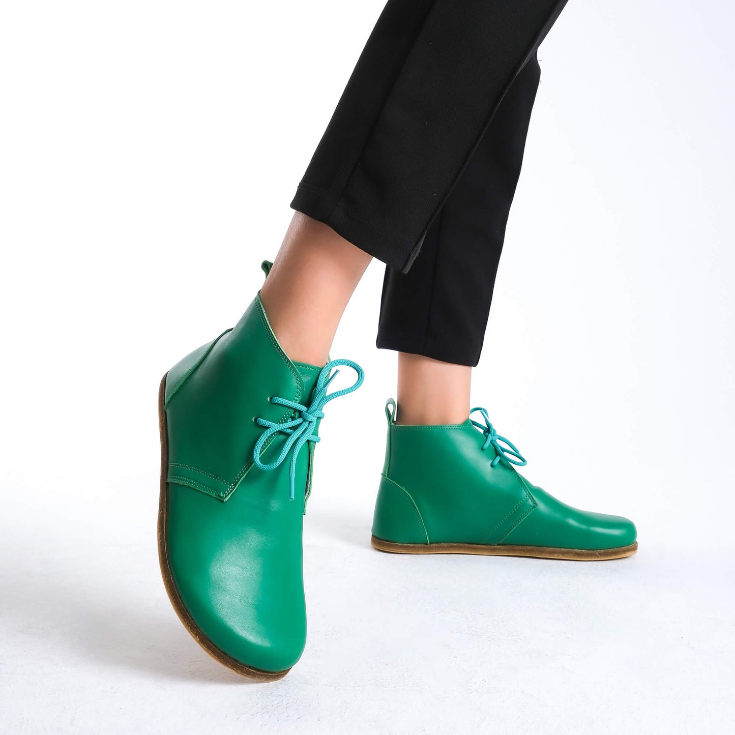 Versatile green barefoot ankle boots, blending style and comfort effortlessly.