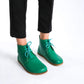 Premium green barefoot boots showcasing a sleek design for a modern aesthetic.