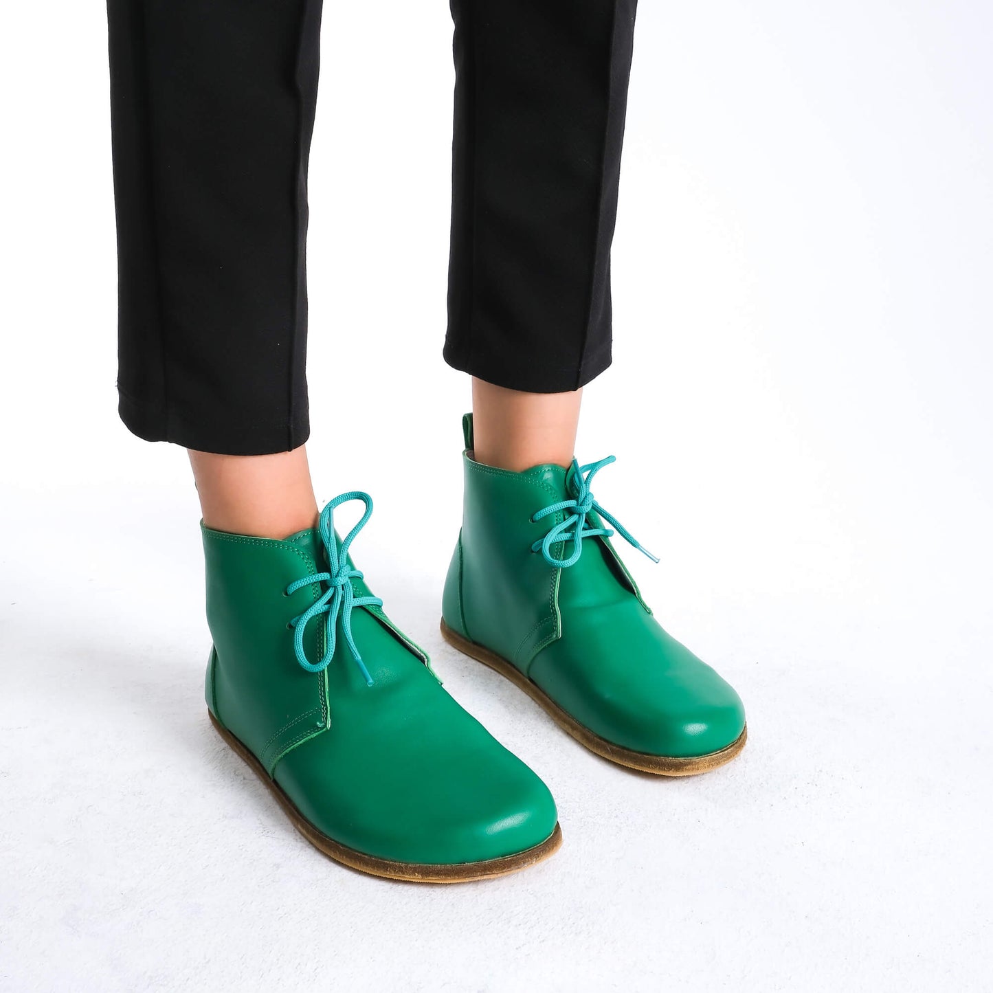 Premium green barefoot boots showcasing a sleek design for a modern aesthetic.