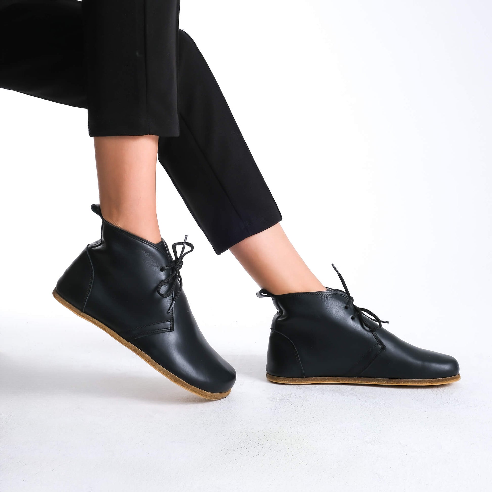 Chic black barefoot boots, designed for natural walking and everyday wear.