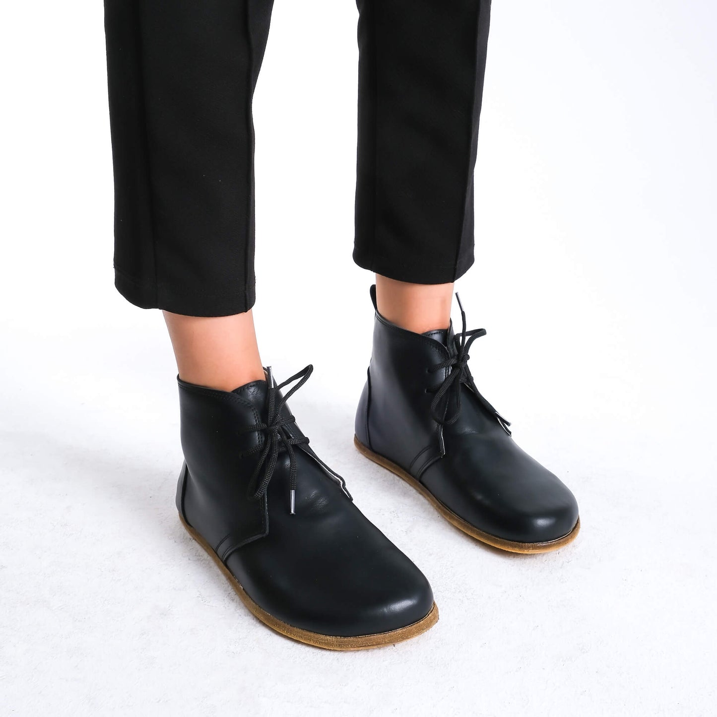 Premium black barefoot boots showcasing a sleek design for a modern aesthetic.