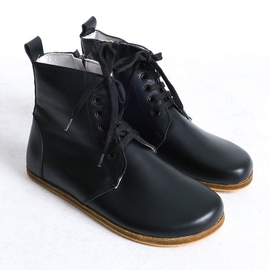 Stylish black barefoot ankle boots with a sleek design and lace-up front, perfect for modern casual wear.