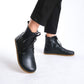 Durable black barefoot ankle boots with lace details, ideal for both everyday and active use.