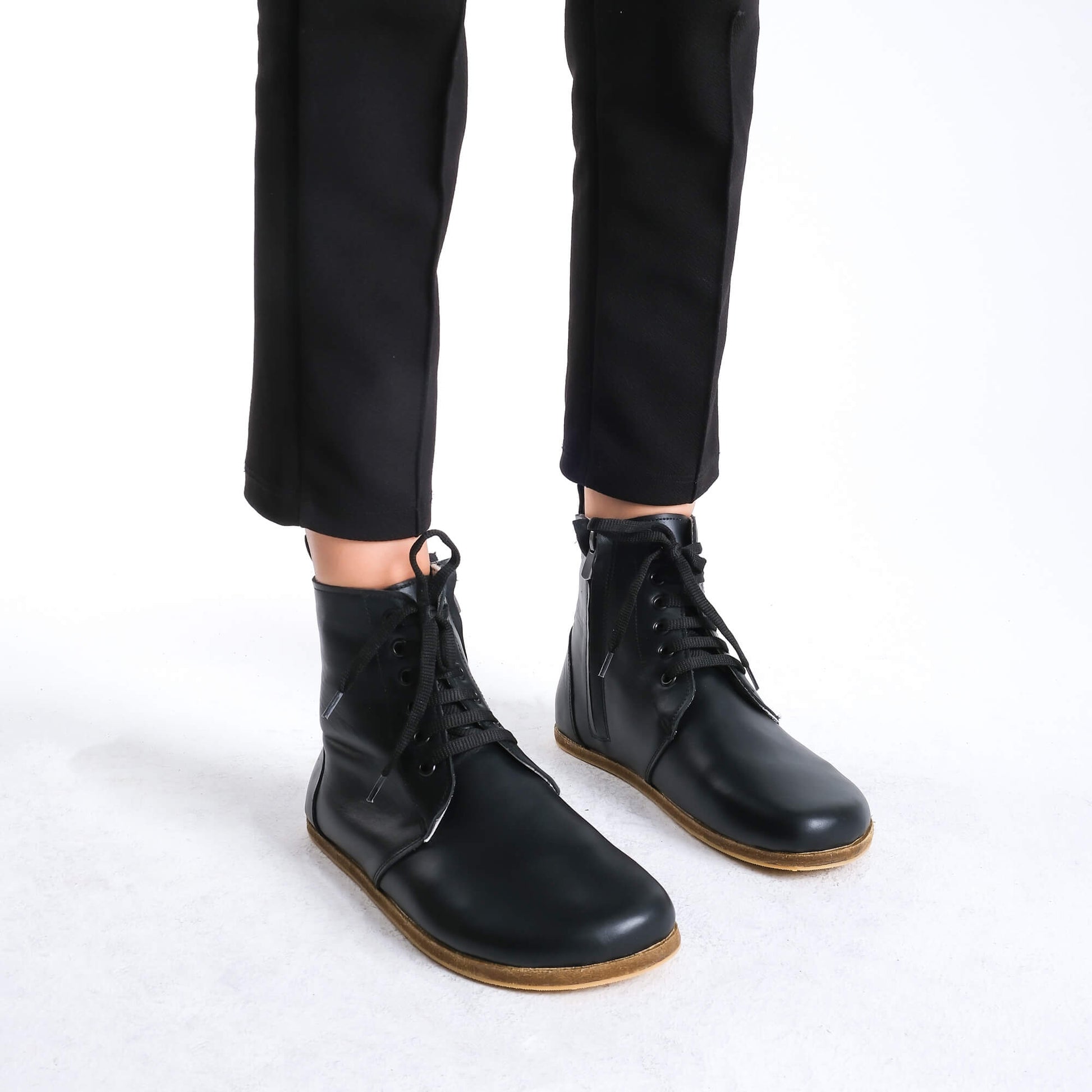 Premium black leather barefoot boots showcasing a contemporary design for a polished look.