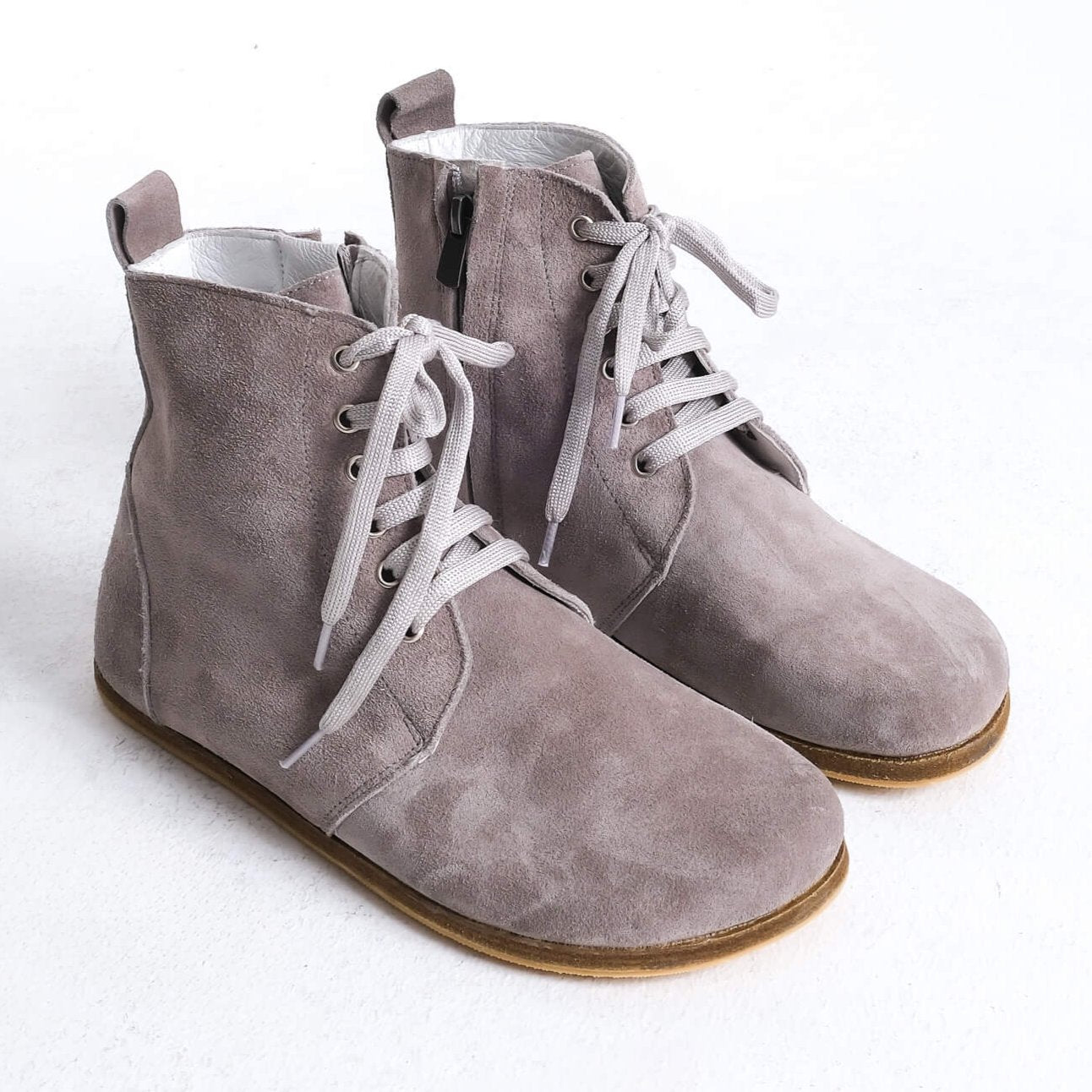 Stylish gray barefoot ankle boots with a sleek design and lace-up front, perfect for modern casual wear.