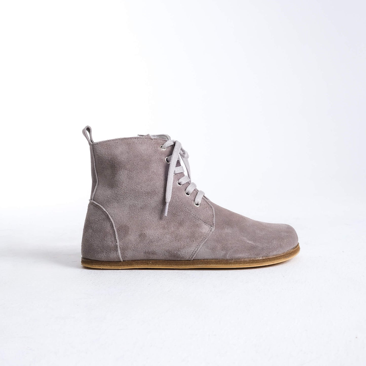 Versatile gray barefoot boots featuring a unique design and sturdy construction for all-day wear.