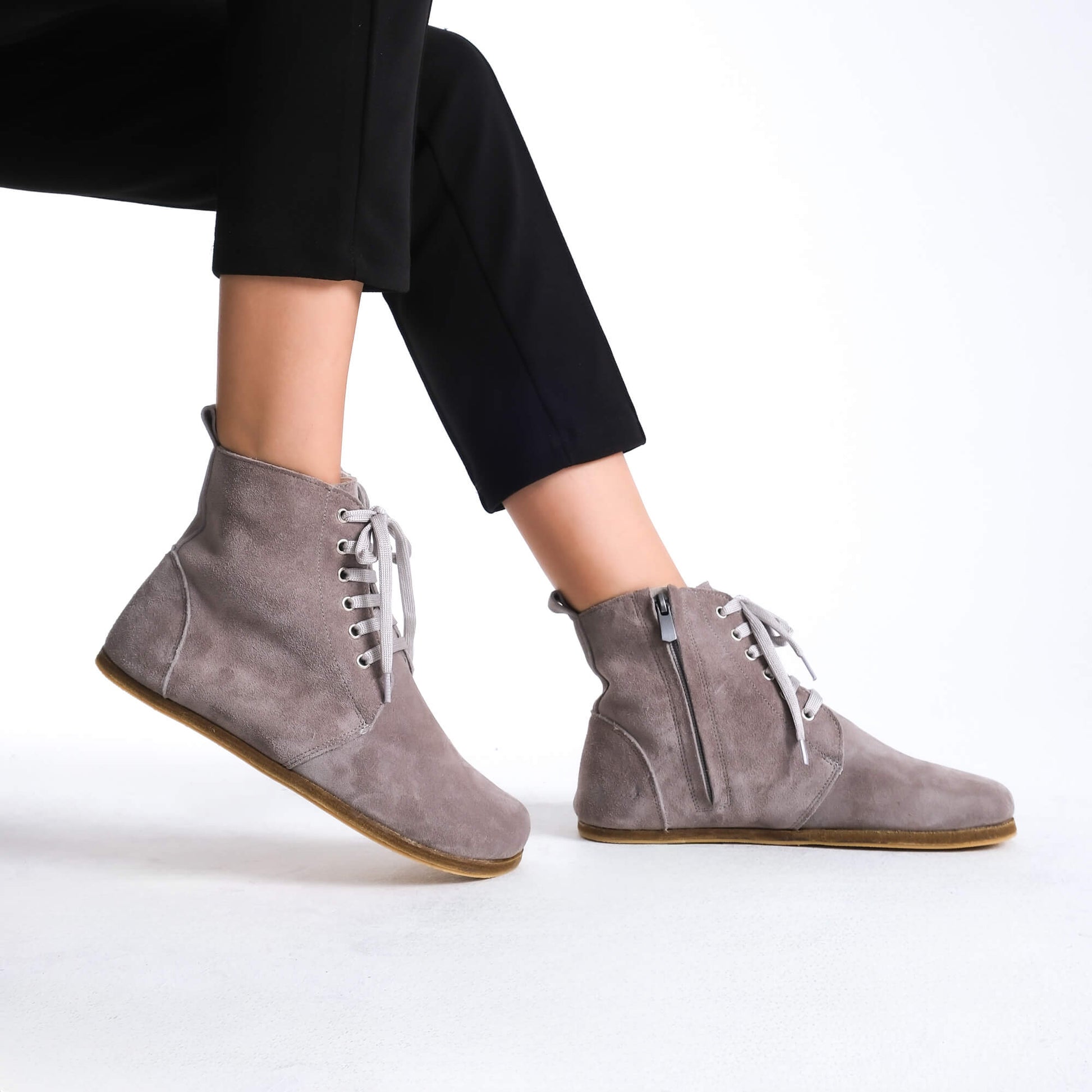 Premium gray leather barefoot boots showcasing a contemporary design for a polished look.