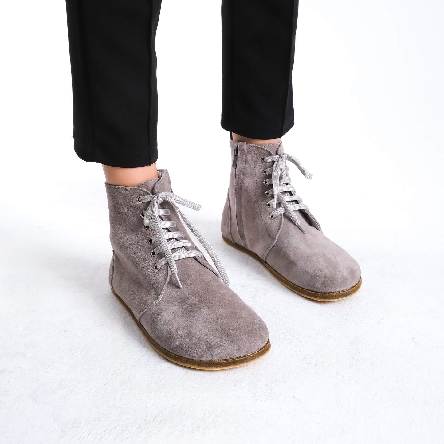 Chic gray barefoot boots featuring a minimalist style, designed for comfort and flexibility.