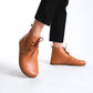 Versatile tan brown barefoot ankle boots, blending style and comfort effortlessly.