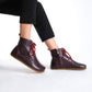 Chic burgundy barefoot boots featuring a minimalist style, designed for comfort and flexibility.