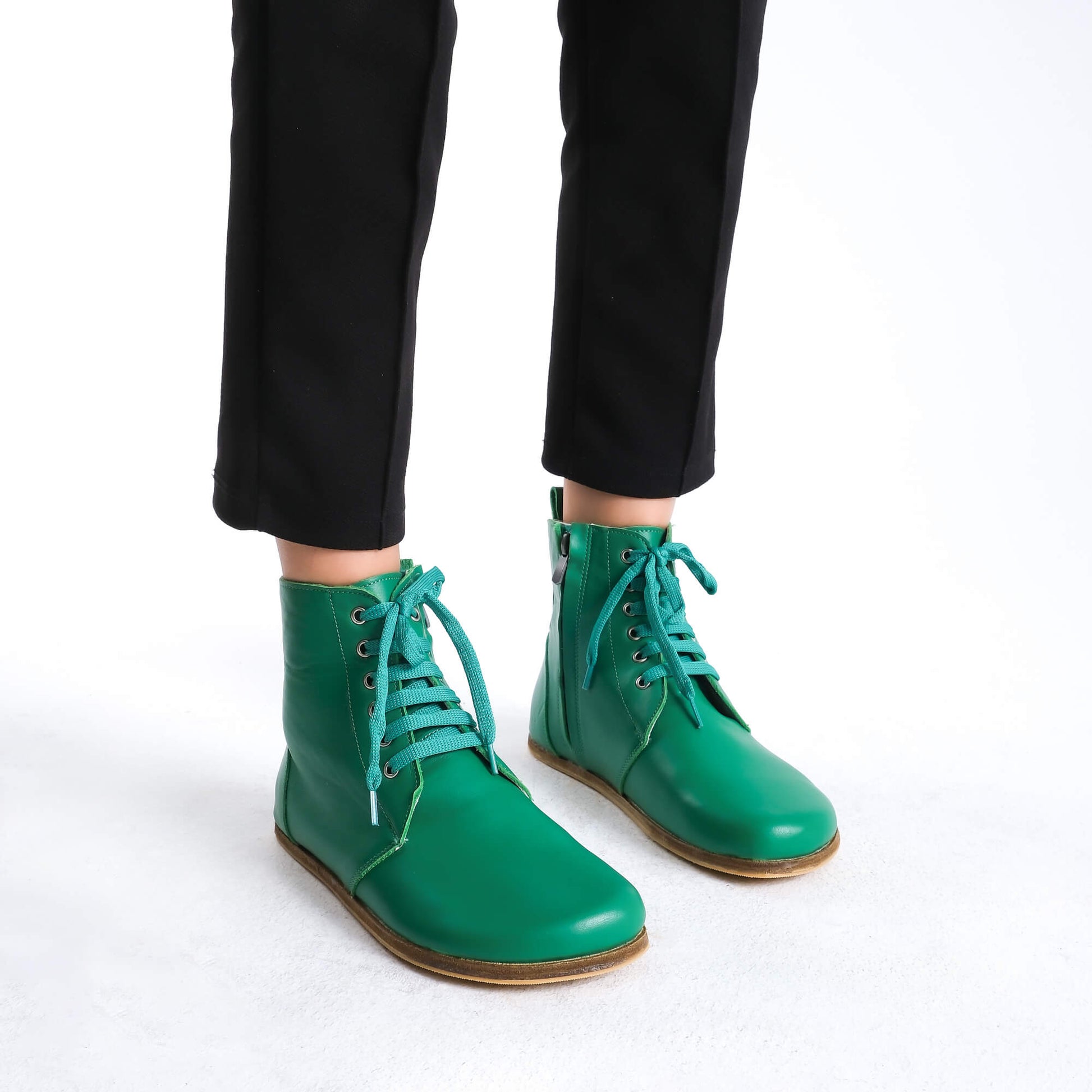 Durable green barefoot ankle boots with lace details, ideal for both everyday and active use.