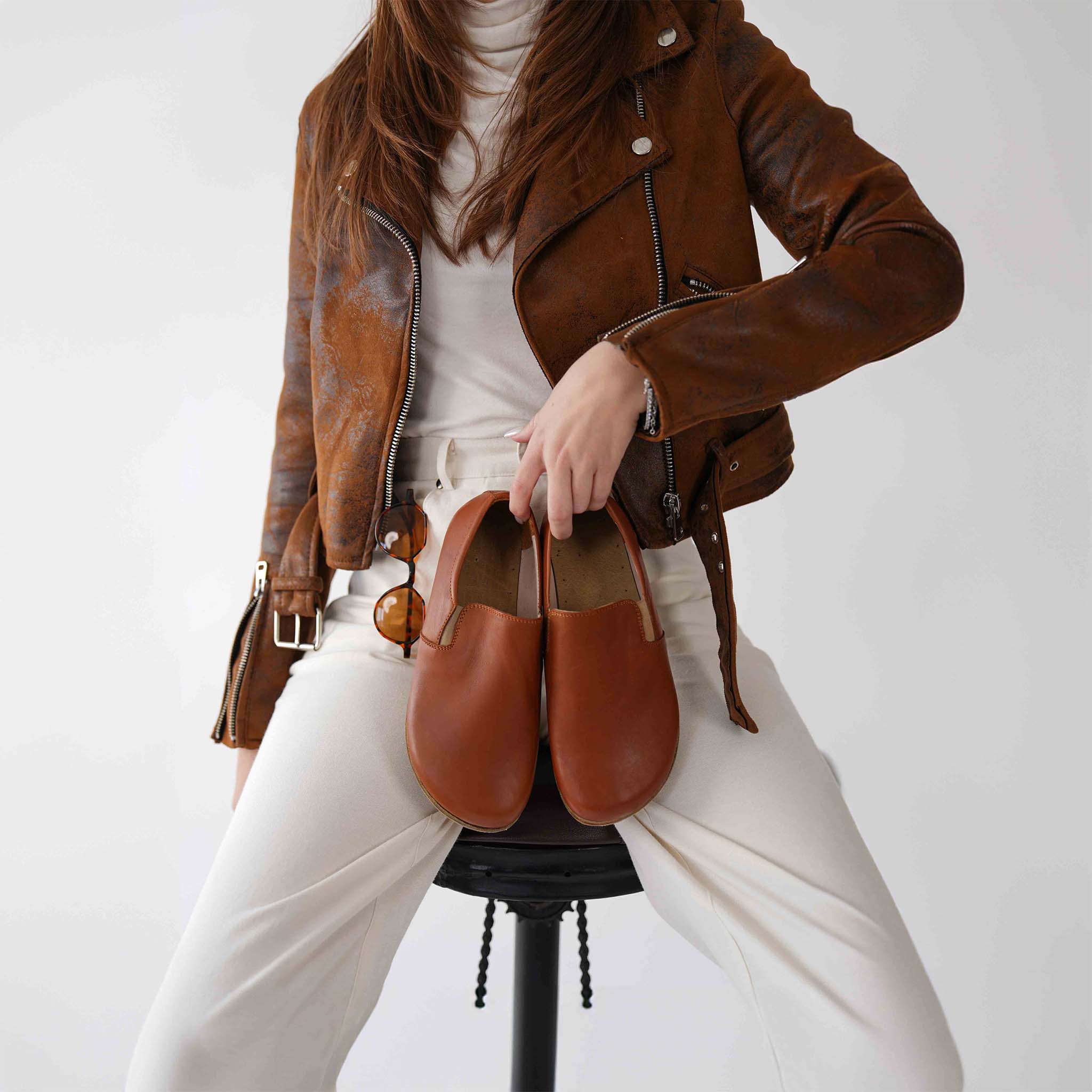 Tan brown Ionia leather barefoot loafers among other color options, demonstrating their versatility and style.