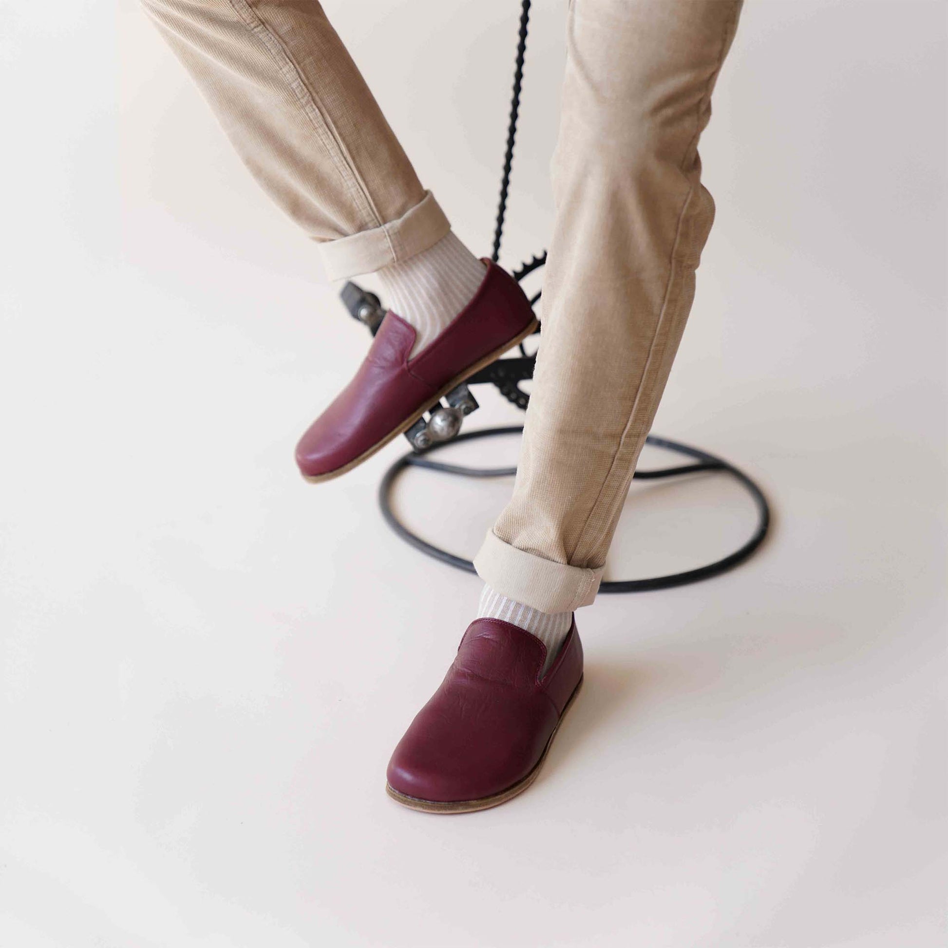 Relaxed style with Burgundy Aeolia Leather Barefoot Men's Loafers, worn with beige pants and white socks, perfect for everyday wear.