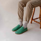 Casual look with Green Aeolia Leather Barefoot Men's Loafers, paired with beige pants and white socks, ideal for everyday wear.