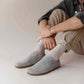 Casual look with Gray suede Aeolia Leather Barefoot Men's Loafers, paired with beige pants and white socks for a comfortable and stylish outfit.