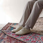 Detailed shot of beige Doris Leather Barefoot Men's Oxfords, emphasizing intricate stitching and design.