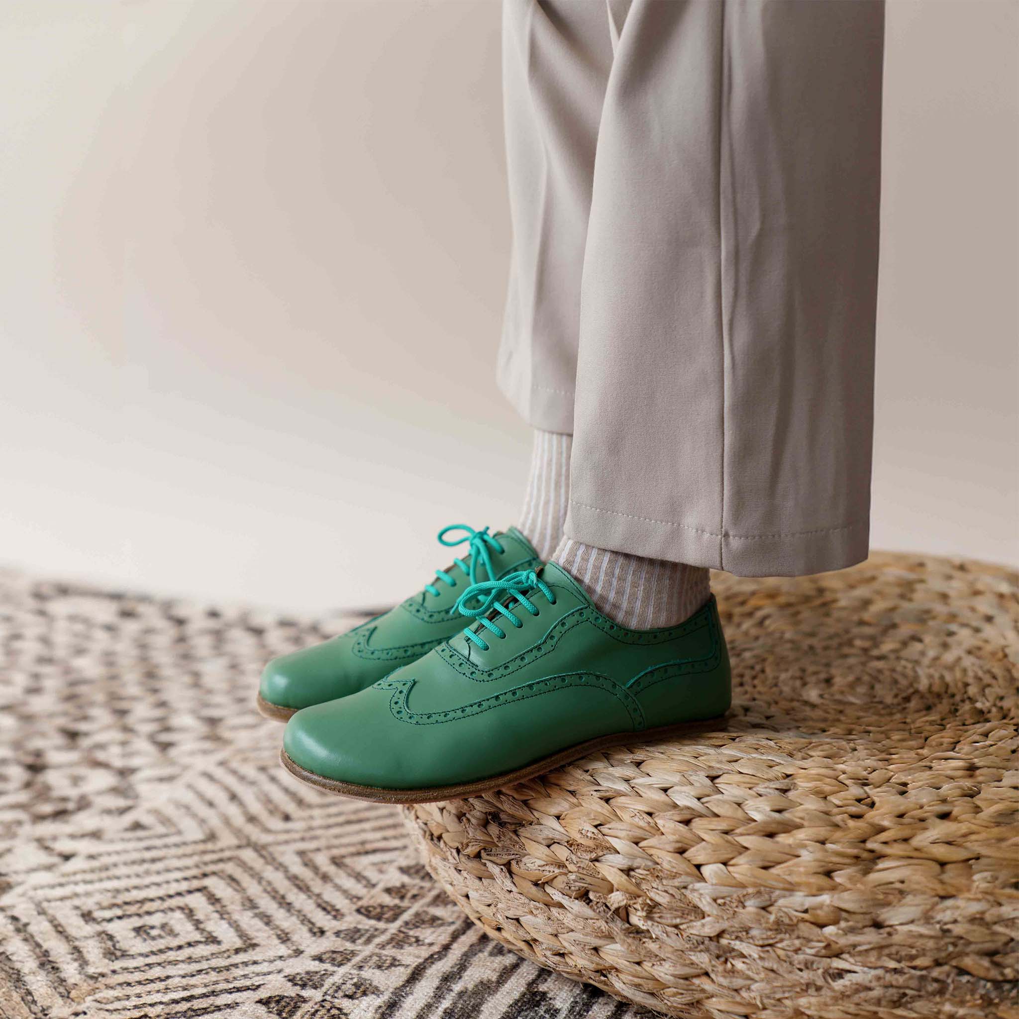 Green Doris Leather Barefoot Oxfords on a man, demonstrating the natural fit and comfort of the shoes.