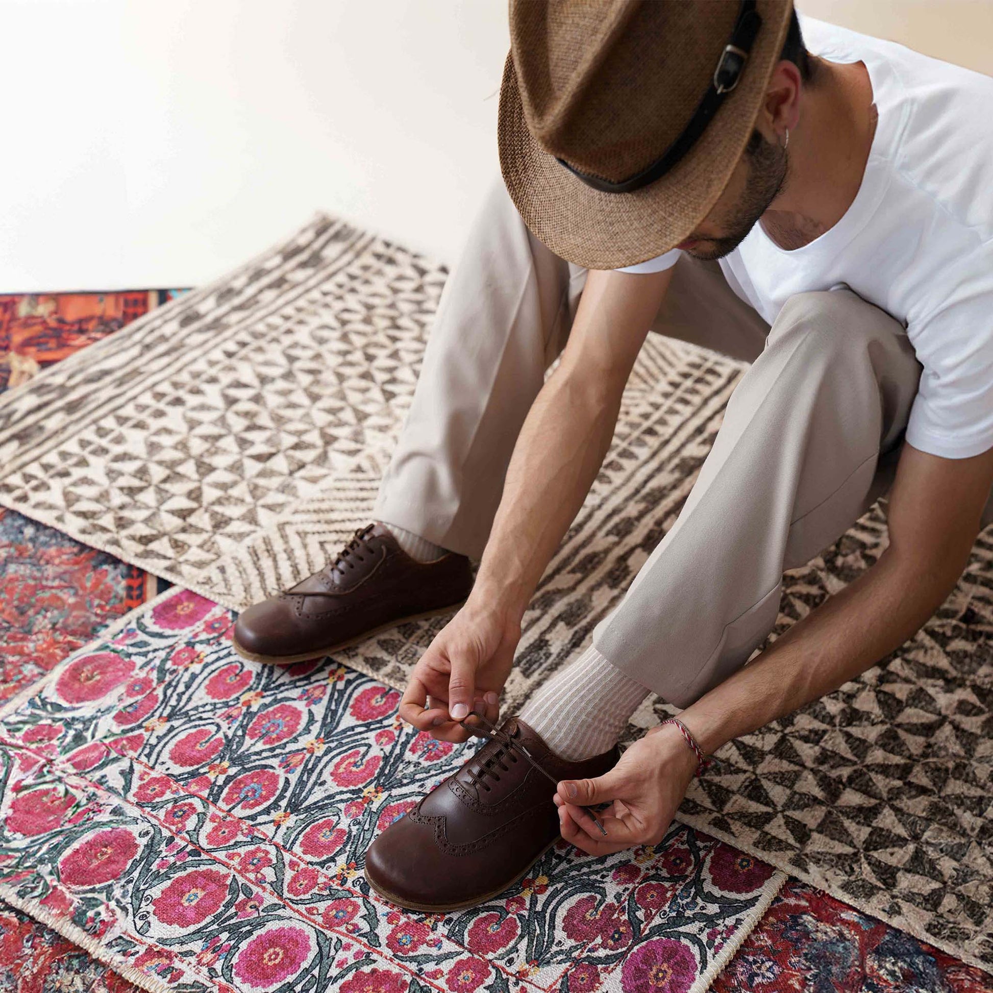 Stylish brown Doris Leather Barefoot Men's Oxfords paired with modern trousers, ideal for versatile wear.