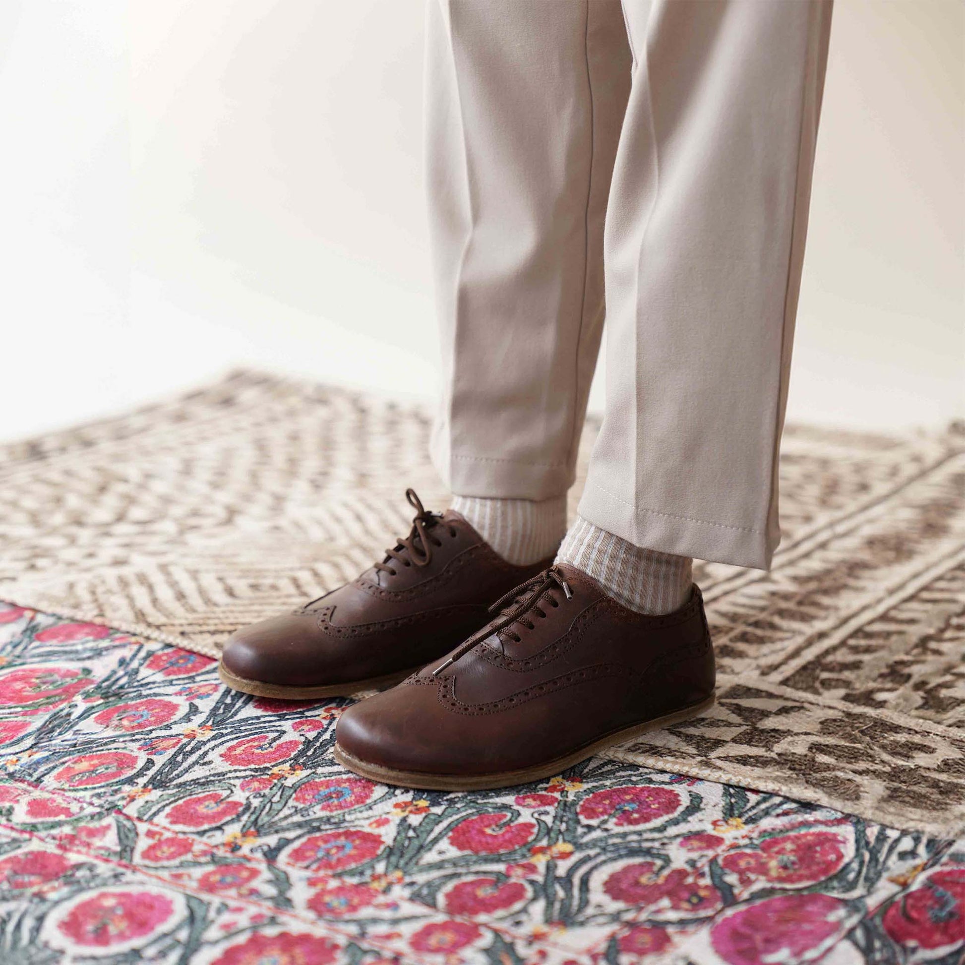 Brown Doris Leather Barefoot Men's Oxfords on feet, emphasizing their zero-drop design and natural foot health benefits.