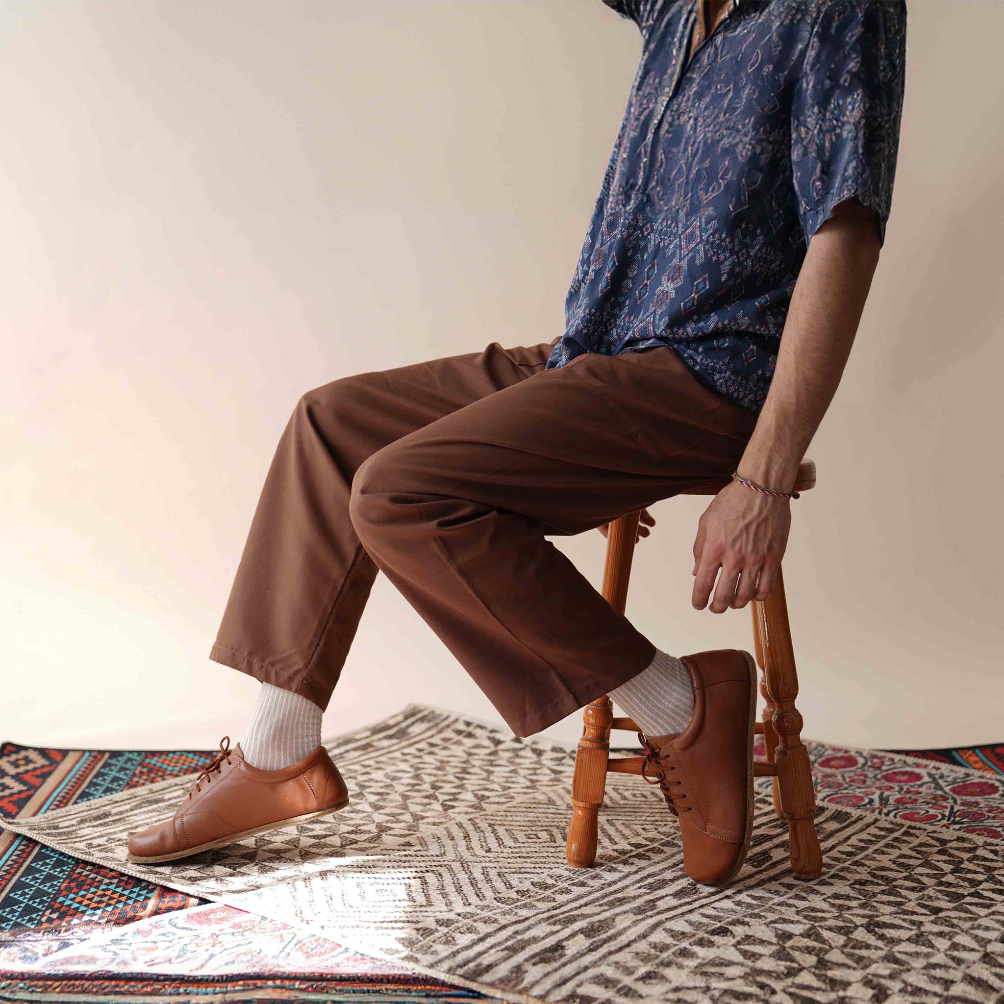 Fashion-forward tan brown Lydia Leather Barefoot Men's Sneakers, combining style with foot health benefits.